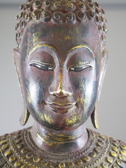 null 
THAILAND 20th century.





Buddha in gilded wood and polychrome.





Height:...