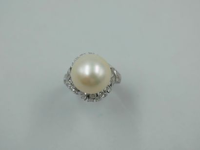 null An 18k white gold ring with a large cultured pearl of about 12mm in diameter...