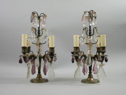 null A pair of electrified girandoles with four arms of light, in gilt bronze with...