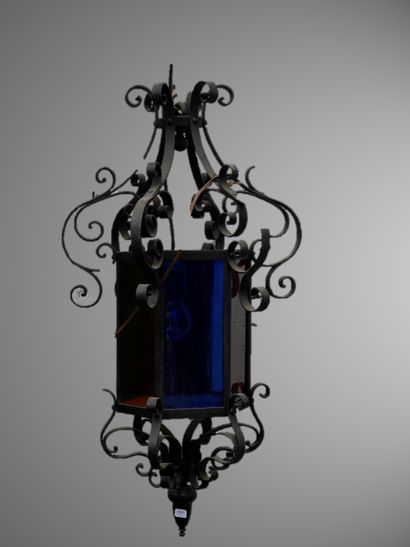 null Multicolored glass and wrought iron cage chandelier with volutes. 

20th ce...