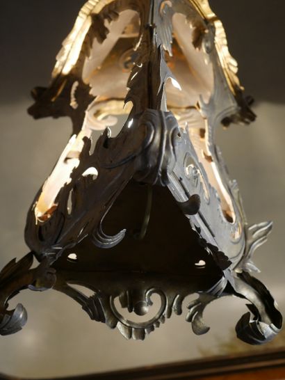 null Lantern of triangular section out of sheet metal cut out and gilded in the shape...