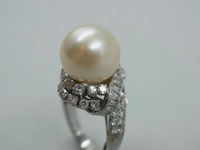 null An 18k white gold ring with a large cultured pearl of about 12mm in diameter...