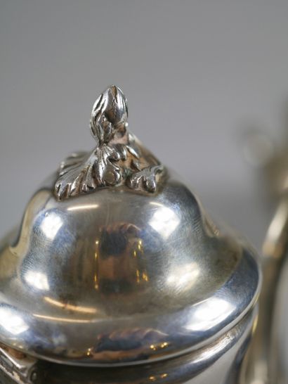 null Head to head composed of a silver coffee pot and a sugar bowl with foliage decoration...