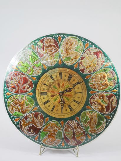 null Circular glass wall clock decorated with the twelve signs of the zodiac in cartouches...