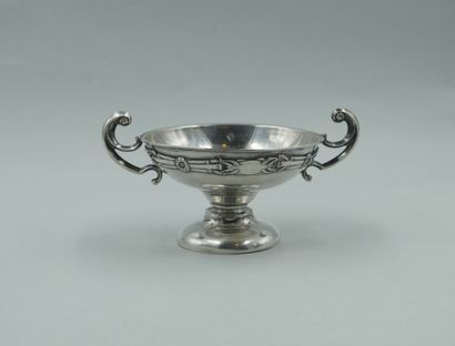 null Circular silver plated cup with ribbons and laurel leaves decorations, handles...