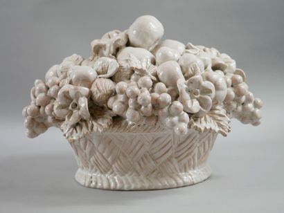 null White glazed ceramic sculpture representing a wicker basket filled with fruits...