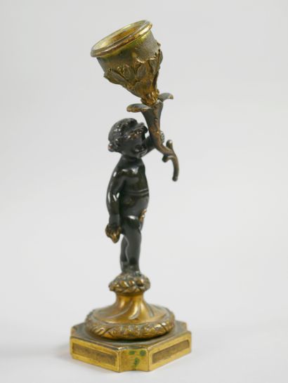 null French school XIXth century. 

Candlestick representing a putto. 

Proof in...