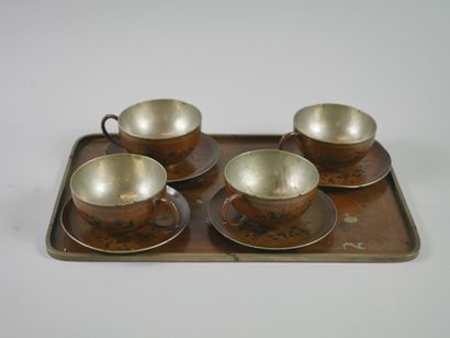 null CHINA 20th century. 

Pewter tea service enamelled with flowers, scrolls and...