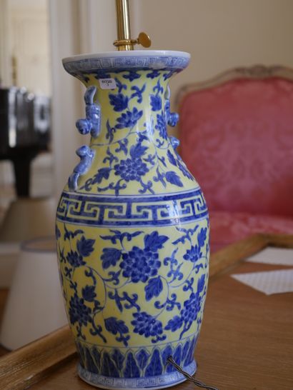 null CHINA, 20th century. 

A baluster-shaped lamp base decorated in blue on a yellow...