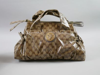 null GUCCI. 

Handbag in waxed canvas with monogram, crest on the outside, double...