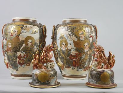 null SATSUMA. 

Pair of satsuma earthenware covered vases decorated with wise men...