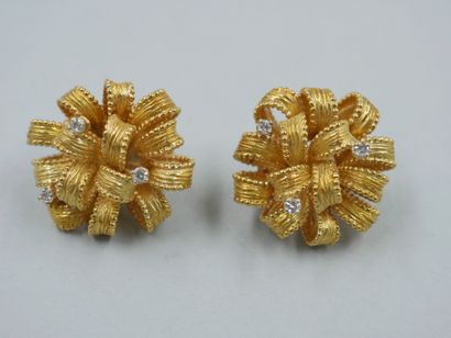 A pair of 18k yellow gold ribbon earrings...