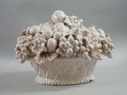 null White glazed ceramic sculpture representing a wicker basket filled with fruits...