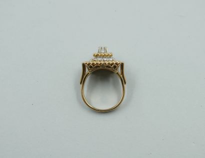 null 18k yellow gold square bezel ring, the pyramid shape centered by a diamond,...