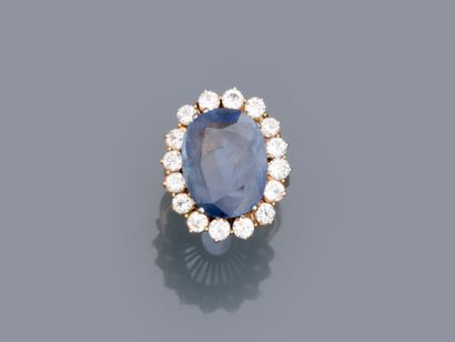 null 18k white and yellow gold pompadour ring set with a large clear sapphire of...