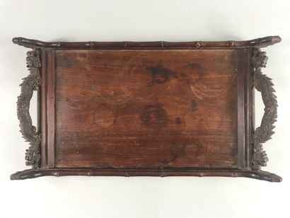 null CHINA, 20th century.

Quadrangular carved wooden tray bordered with bamboo stems...