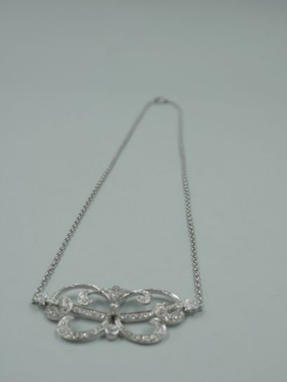 null Necklace with openwork platinum flower scrolls, paved with diamonds and flanked...