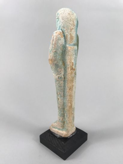 null Large turquoise fritware oushebti inscribed with an important dignitary.

Late...