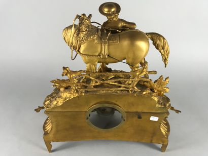 null Gilt bronze clock in the Troubadour style representing a young boy and his horse...