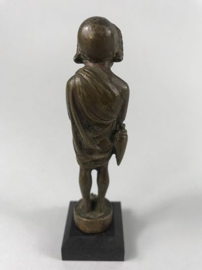 null Theater actor wearing a mask, an amphora attached to one arm. Bronze.

Roman...