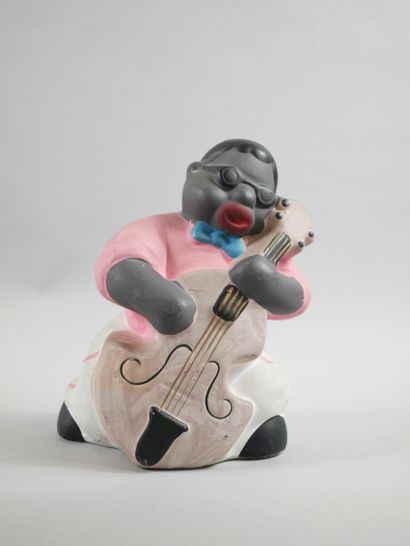 null Player of double bass. 

Polychrome ceramic proof, forming a money box. 

Around...