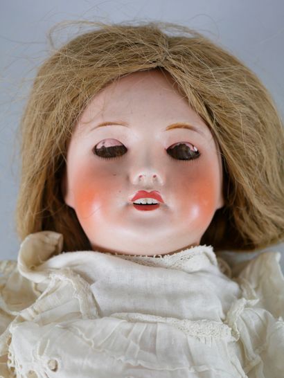 null UNIS FRANCE Porcelain head intact. Open mouth, sleeping blue eyes, articulated...