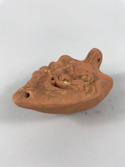 null Oil lamp in terracotta of Roman style decorated with a head of Satyr. 

Length...