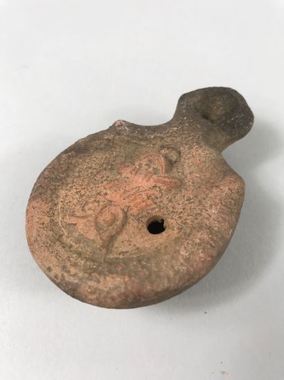 null Oil lamp in terracotta of Roman style decorated with the owl of Minerva Goddess...