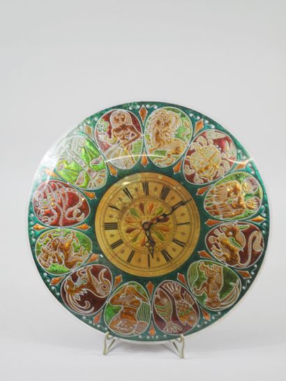 null Circular glass wall clock decorated with the twelve signs of the zodiac in cartridges...