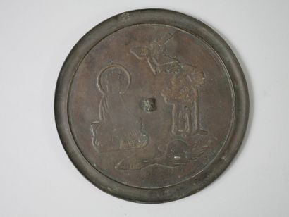 null CHINA 20th century.

Bronze mirror decorated on one side with a sage in a landscape...