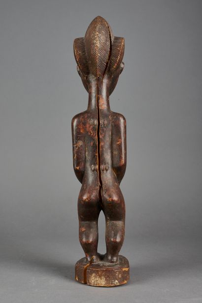 null CÔTE D'IVOIRE, Baoulé. 

Ancêtre bloblobian de l’Au-delà en bois sculpté. 

Haut....