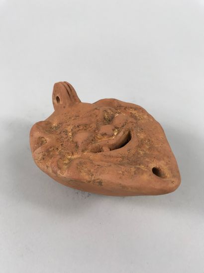 null Oil lamp in terracotta of Roman style decorated with a head of Satyr. 

Length...