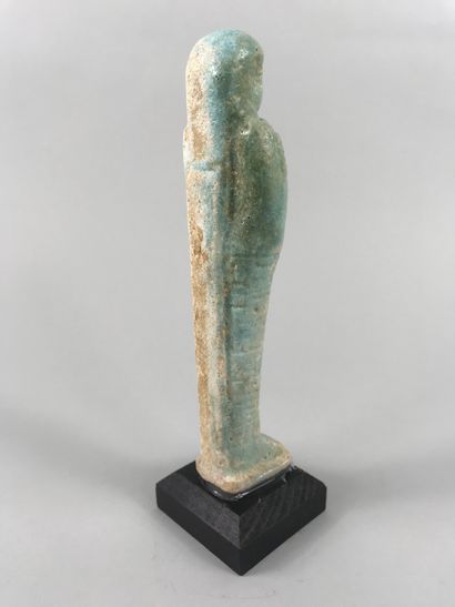 null Large turquoise fritware oushebti inscribed with an important dignitary.

Late...
