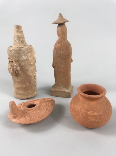null Lot including various antique terracottas of which an oil lamp and a woman wearing...