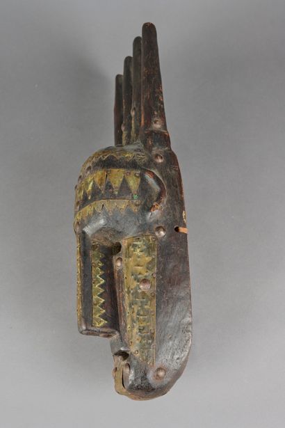 null MALI, Bambara. 

Mask in carved wood and metal.

Height: 44 cm. 

(In the s...
