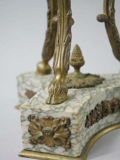 null In the taste of GOUTHIERE

Pair of large cassolettes in green veined marble...
