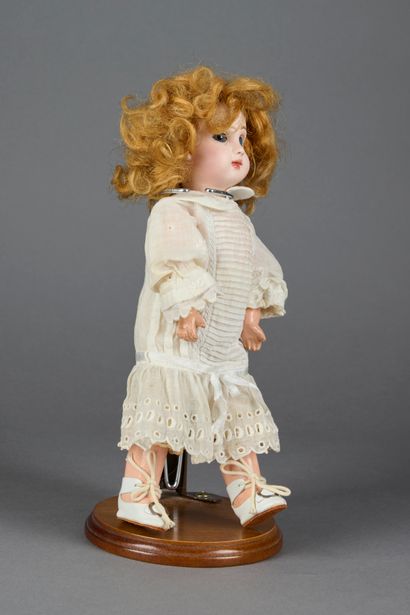 null 
French doll with bisque head, closed mouth marked SFBJ 301 Paris, blue fixed...