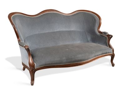 Three-seat basket sofa in molded mahogany....