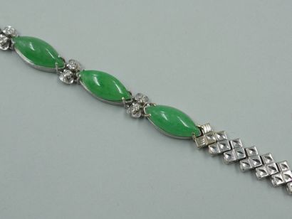 null Bracelet in 14k white gold decorated with four cabochon of jade and diamonds....