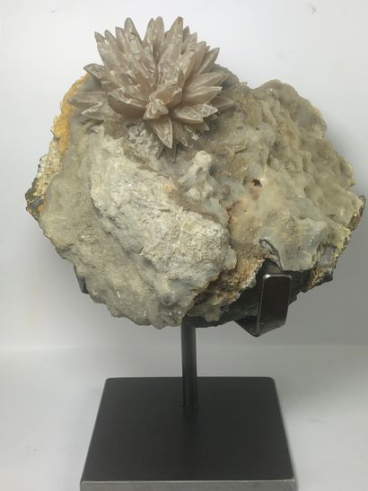 null A calcite flower with a diameter of 10 cm on a gangue 24 x 18 x 12 cm. 

Slight...