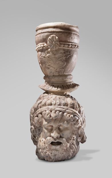 null Fountain element composed of a head of a bearded and moustachioed faun sculpted...