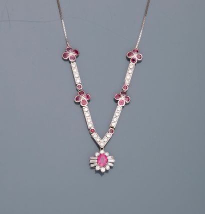 null 
18K white gold necklace holding four flowers, the petals adorned with round...