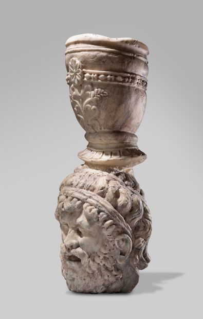 null Fountain element composed of a head of a bearded and moustachioed faun sculpted...