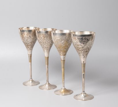 null Four wine glasses on foot out of silver plated metal, with reason of interlaced...