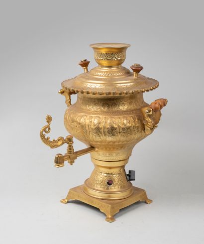 null Samovar in gilded brass with incised decoration of processions and floral motifs,...