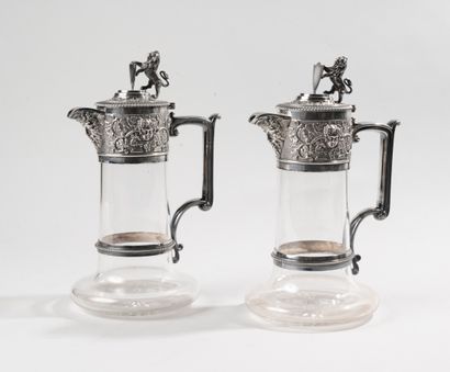 null ELKINGTON. 

Pair of ewers out of cut glass, the mount out of silver plated...