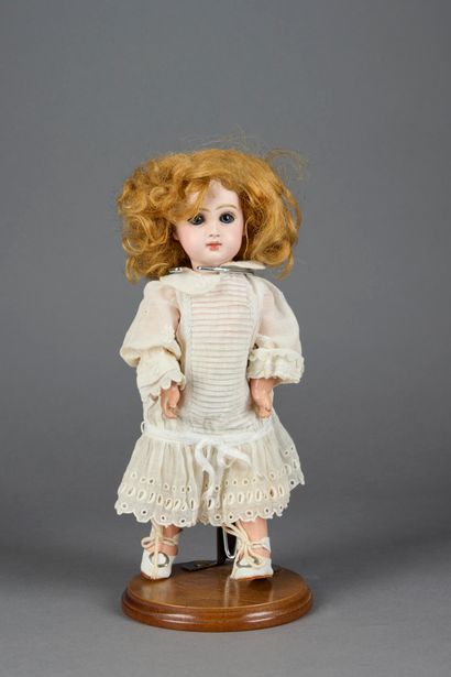 null 
French doll with bisque head, closed mouth marked SFBJ 301 Paris, blue fixed...