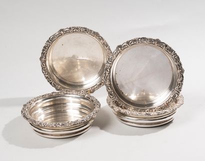 null C.BALAINE. 

Series of four coasters in silver plating on the wing with rocaille...
