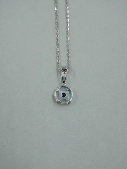 null 18K white gold pendant composed of a circular pattern set with four opal cabochon...
