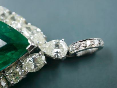 null Important 18k white gold drop pendant set with a 14 ct pear cut emerald surrounded...